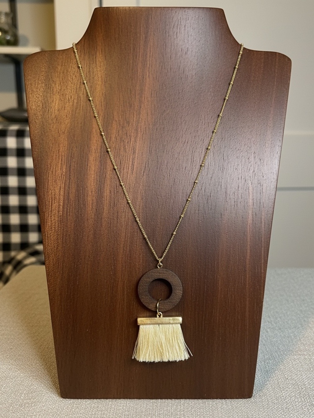 Gold Chain Necklace with Brown Wood Ring and Cream Tassel
